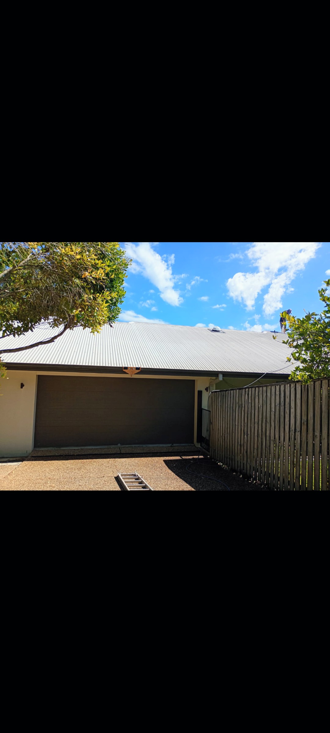 Clean modern garage with pristine driveway