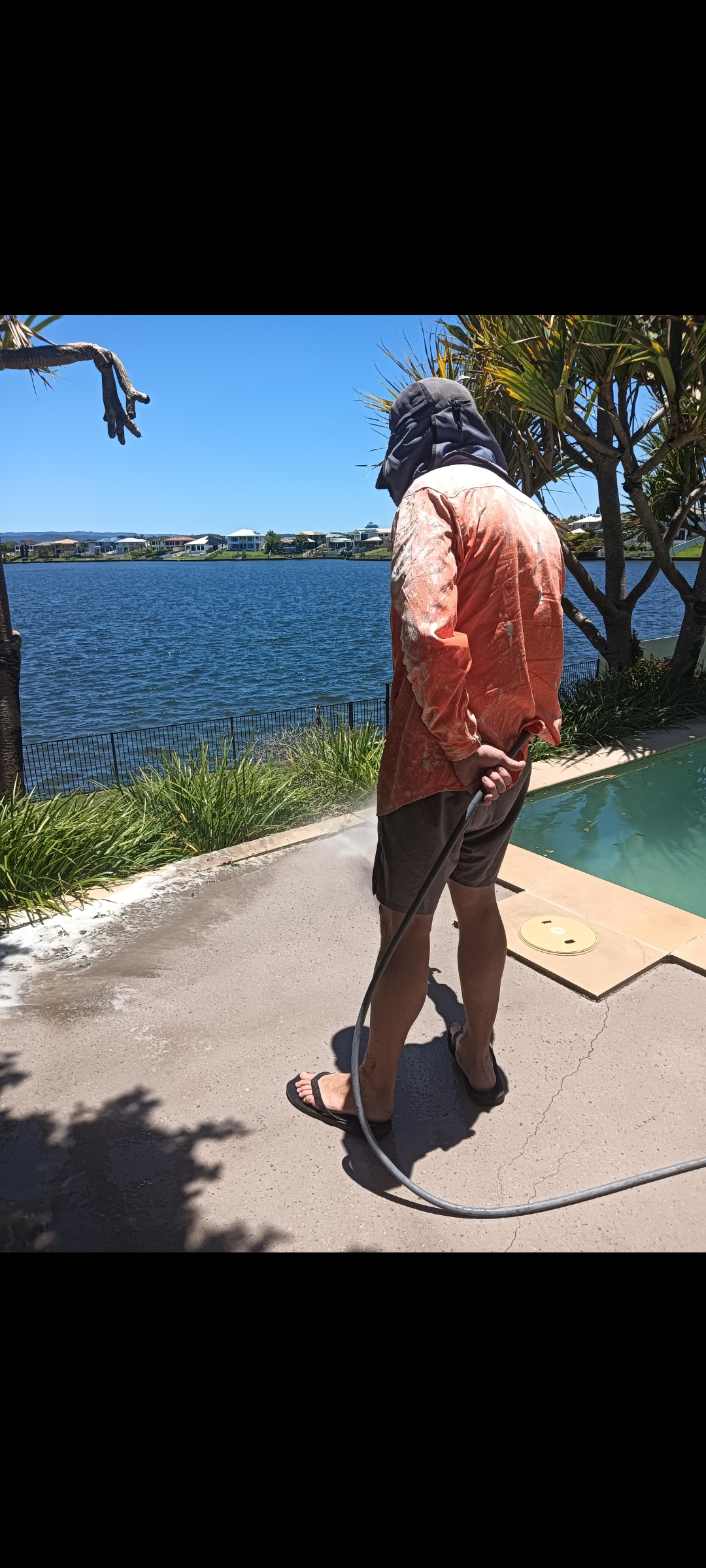 Waterfront pool cleaning in action